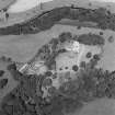Oblique aerial view centred on the castle, tower-house and stables, taken from the SSW.