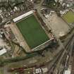 Oblique aerial view centred on the football stadium, taken from the NW.