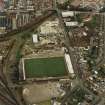 Oblique aerial view centred on the football stadium, taken from the SW.