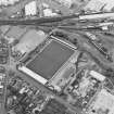 Oblique aerial view centred on the football stadium, taken from the ENE.