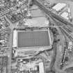 Oblique aerial view centred on the football stadium, taken from the NE.