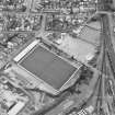 Oblique aerial view centred on the football stadium, taken from the NNW.