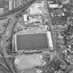 Oblique aerial view centred on the football stadium, taken from the SW.