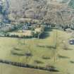 Oblique aerial view centred on the tower-house, taken from the SE.