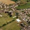 Oblique aerial view of Tarbolton centred on the church and churchyard, taken from the SW.