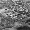 Oblique aerial view of Craigneuk St, Motherwell, centred on the Anderson Boyes Works, taken from the NNW.