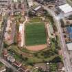 Oblique aerial view centred on the football stadium, taken from the WNW.