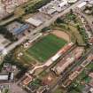 Oblique aerial view centred on the football stadium, taken from the NE.