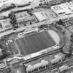 Oblique aerial view centred on the football stadium, taken from the NE.