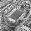 Oblique aerial view centred on the football stadium, taken from the WSW.