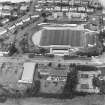 Oblique aerial view centred on the football stadium, taken from the SSW.