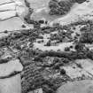 Formakin, oblique aerial view, taken from the ENE, showing Formakin Mill, and out-buildings and the gateway of Formakin House in the centre left of the photograph, and Formakin House in the centre right.