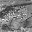 Oblique aerial view centred on the hospital, taken from the WNW.