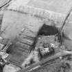 Oblique aerial view centred on the remains of an anti-aircraft battery, taken from the WSW.