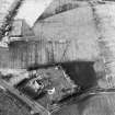 Oblique aerial view centred on the remains of an anti-aircraft battery, taken from the S.