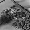 Oblique aerial view of the tower-house, country house, farmsteading and horsemill, taken from the SE.