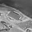 Oblique aerial view centred on the football ground, taken from the NW.