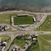 Oblique aerial view centred on the football ground, taken from the N.