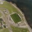 Oblique aerial view centred on the football ground, taken from the W.