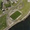 Oblique aerial view centred on the football ground, taken from the SW.