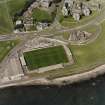 Oblique aerial view centred on the football ground, taken from the S.