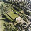 Oblique aerial view centred on the football ground, taken from the N.