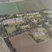 Oblique aerial view centred on the hospital and offices, taken from the SSW.