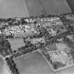 Oblique aerial view centred on the hospital and offices, taken from the SSW.