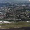 General oblique aerial view of Dundee and the airport, taken from the S.