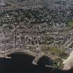 General oblique aerial view of Broughty Ferry centred on the school with the castle and harbour adjacent, taken from the SSW.