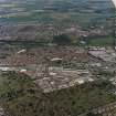 General oblique aerial view of Dundee centred on the works with the cemetery adjacent, taken from the SSW.