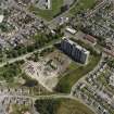 Oblique aerial view of the Ardler Estate centred on a tower block, taken from the SW.