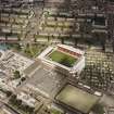 Oblique aerial view centred on the stadium, taken from the SSE.