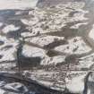 General oblique aerial view of the village with the country house adjacent, taken from the SSW.