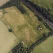 Oblique aerial view of Innerpeffray centred on the remains of the tower house and the cropmarks of a possible garden, a fort, and a pit-alignment, taken from the WNW.