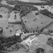 Oblique aerial view of Blair Castle centred on the country house, garden and walled garden, taken from the W.