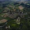 Oblique aerial view centred on the town and village with the military camp adjacent, taken from the NE.