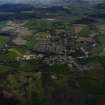 General oblique aerial view centred on the town and village, taken from the NNW.