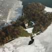 Oblique aerial view of Lochleven Castle in the snow.