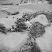 Oblique aerial view of Lude House centred on the country house and farmsteading, taken from the NE.