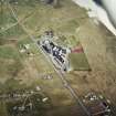 Oblique aerial view centred on the school, the museum and the hotel, with the site of the smithy adjacent, taken from the NNW.