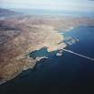 General oblique aerial view centred on the township with the causeway adjacent, taken from the SW.