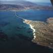 Oblique aerial view centred on the township with the causeway adjacent, taken from the SSW.