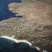 Oblique aerial view centred on the burial grounds with the harbour adjacent, taken from the WSW.