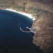 Oblique aerial view centred on the slipway and the jetty  with the remains of the township adjacent, taken from the SW.