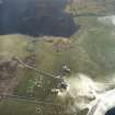 Oblique aerial view centred on the farmstead and house, taken from the NNE.