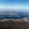 General oblique aerial view looking across Loch Baghasdail towards the village of Lochboisdale, taken from the SW.