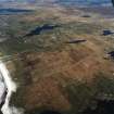 General oblique aerial view centred on the crofting township and remains of the buildings, taken from the SW.