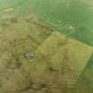 Oblique aerial view centred on the remains of the township and head-dyke, taken from the SW.
