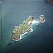 Oblique aerial view centred on the islands and the remains of lazy beds, taken from the SE.